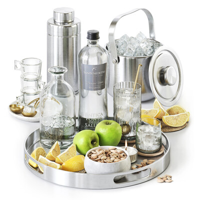 Decorative set on a tray with water and fruits